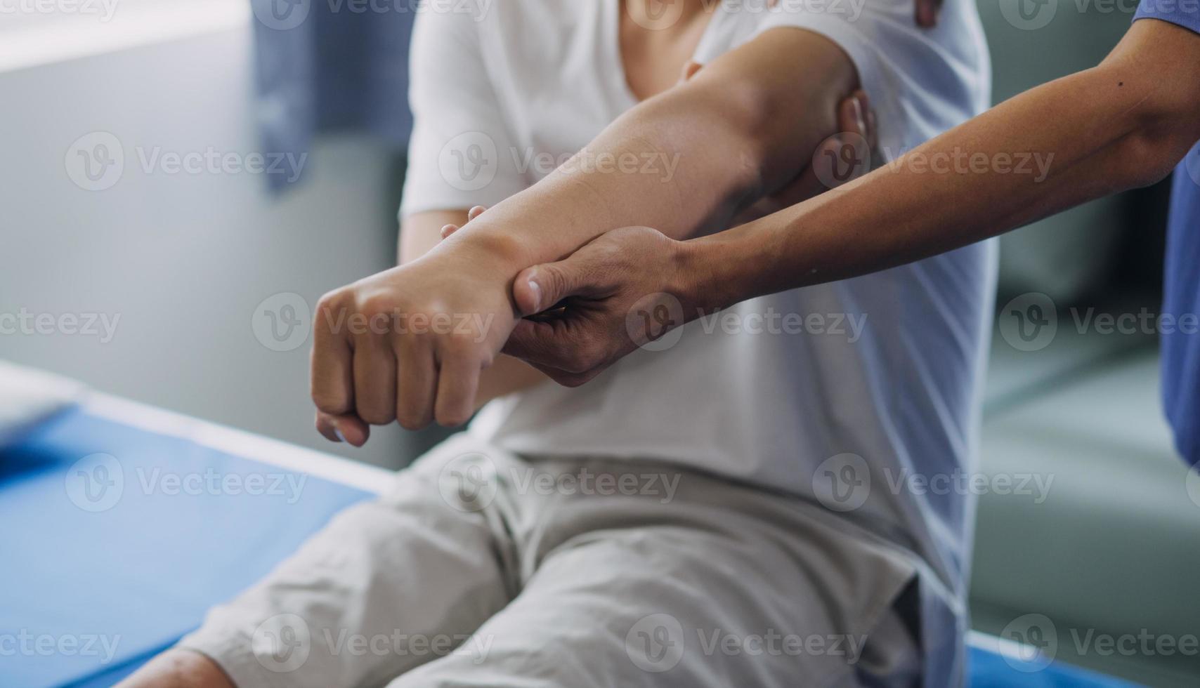 Patient doing some special exercises under supervision in a room photo