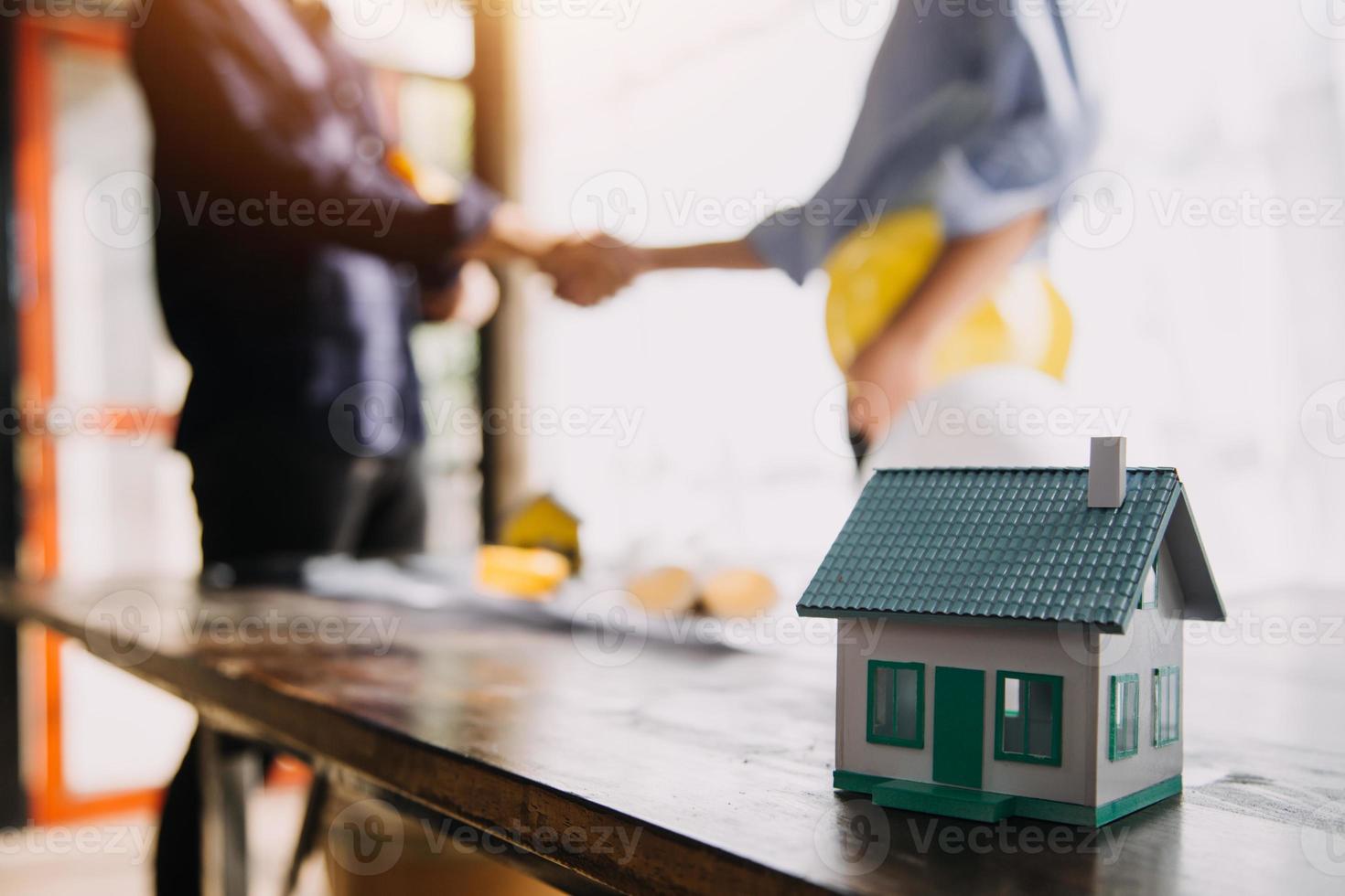 Two business man construction site engineer. Engineering objects on workplace with partners interacting on background photo