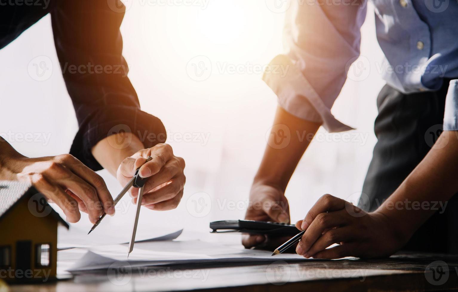 Two business man construction site engineer. Engineering objects on workplace with partners interacting on background photo