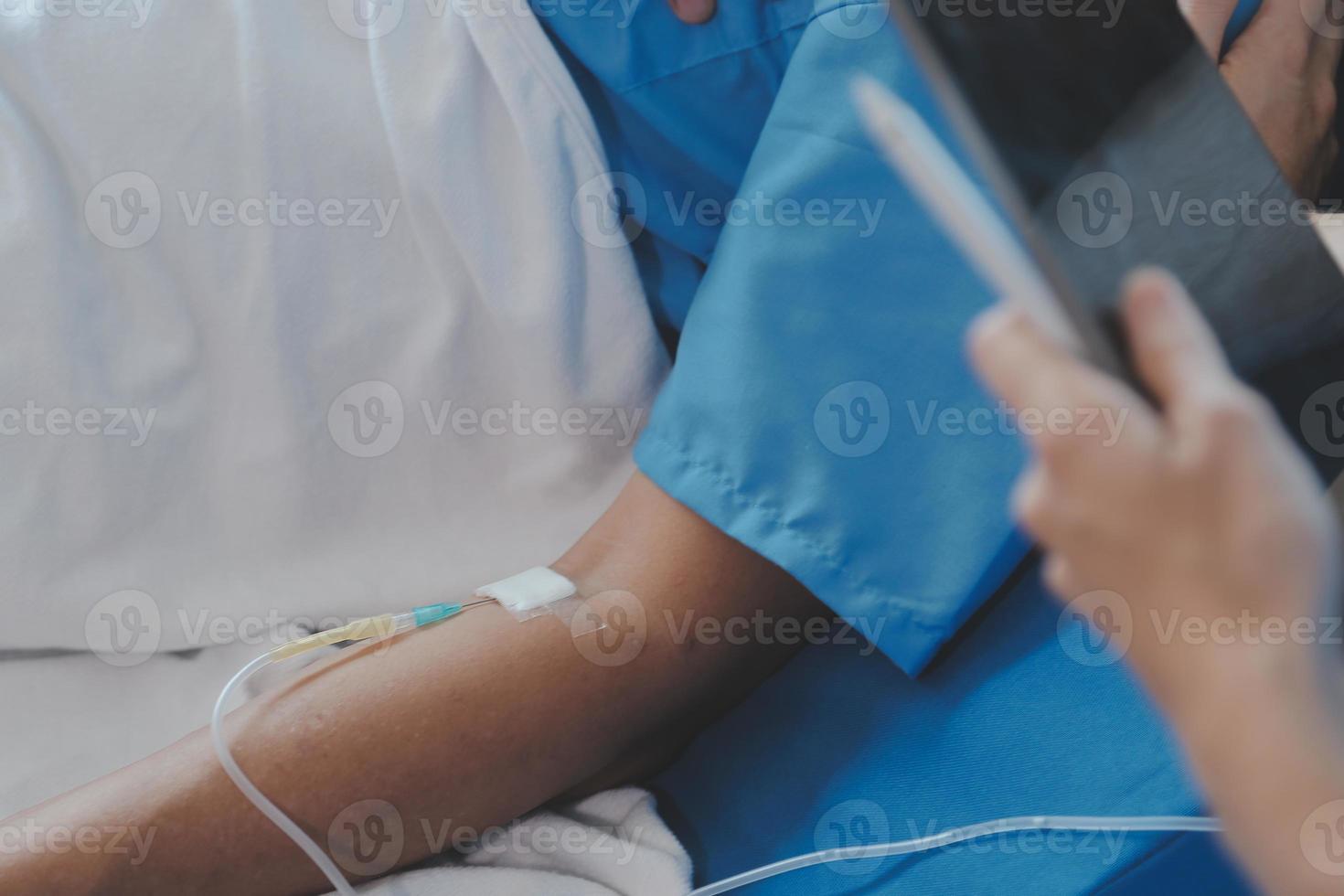 Women Asian doctors hold the patient hand and encourage and provide medical advice While checking the patient health in bed. Concept of Care and compassion, antenatal care, Threatened abortion photo