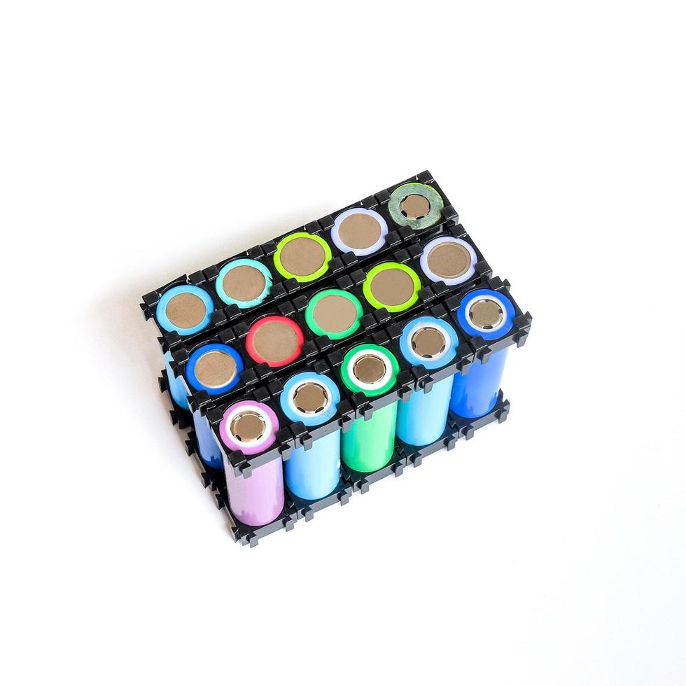 Reused Li ion 18650 battery pack in holder on white. photo