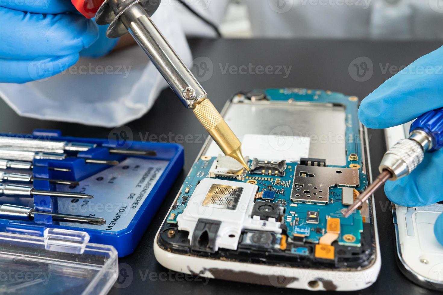 Repairing and upgrade Samsung mobile phone, electronic, computer hardware and technology concept. photo