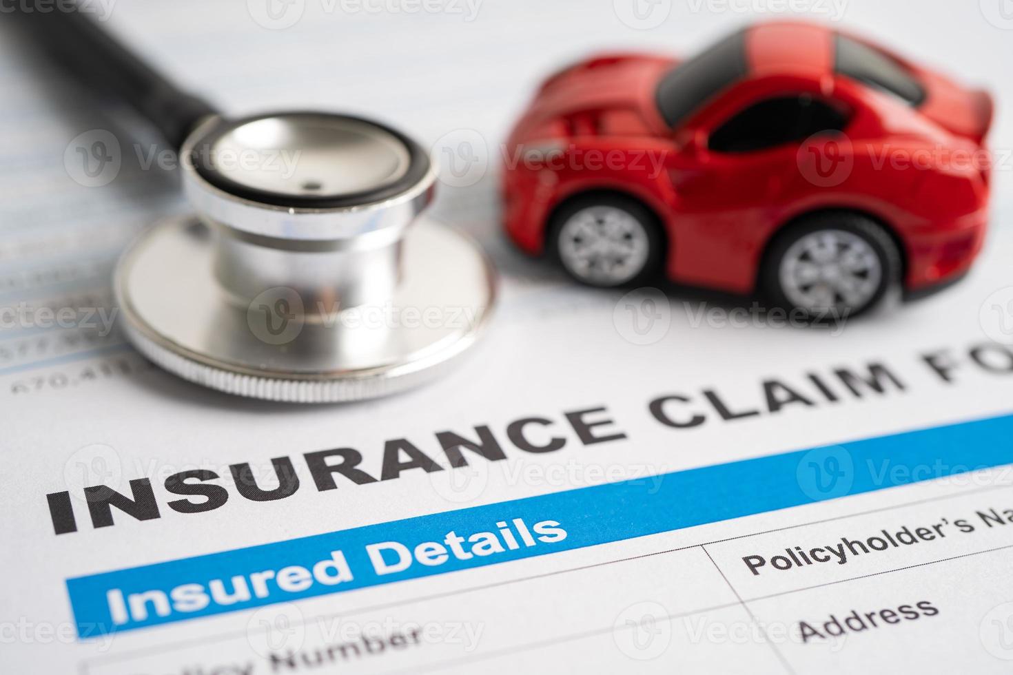 BANGKOK, THAILAND JULY 1, 2022 Stethoscope on Insurance claim accident car form, Car loan, insurance and leasing time concepts. photo