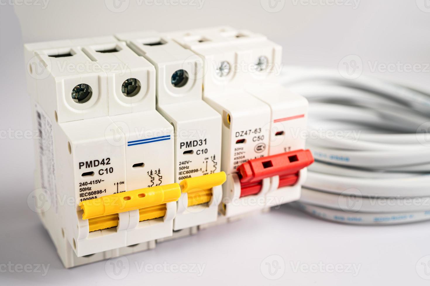 Automatic circuit breaker on white background, control and protect electrical power system. photo