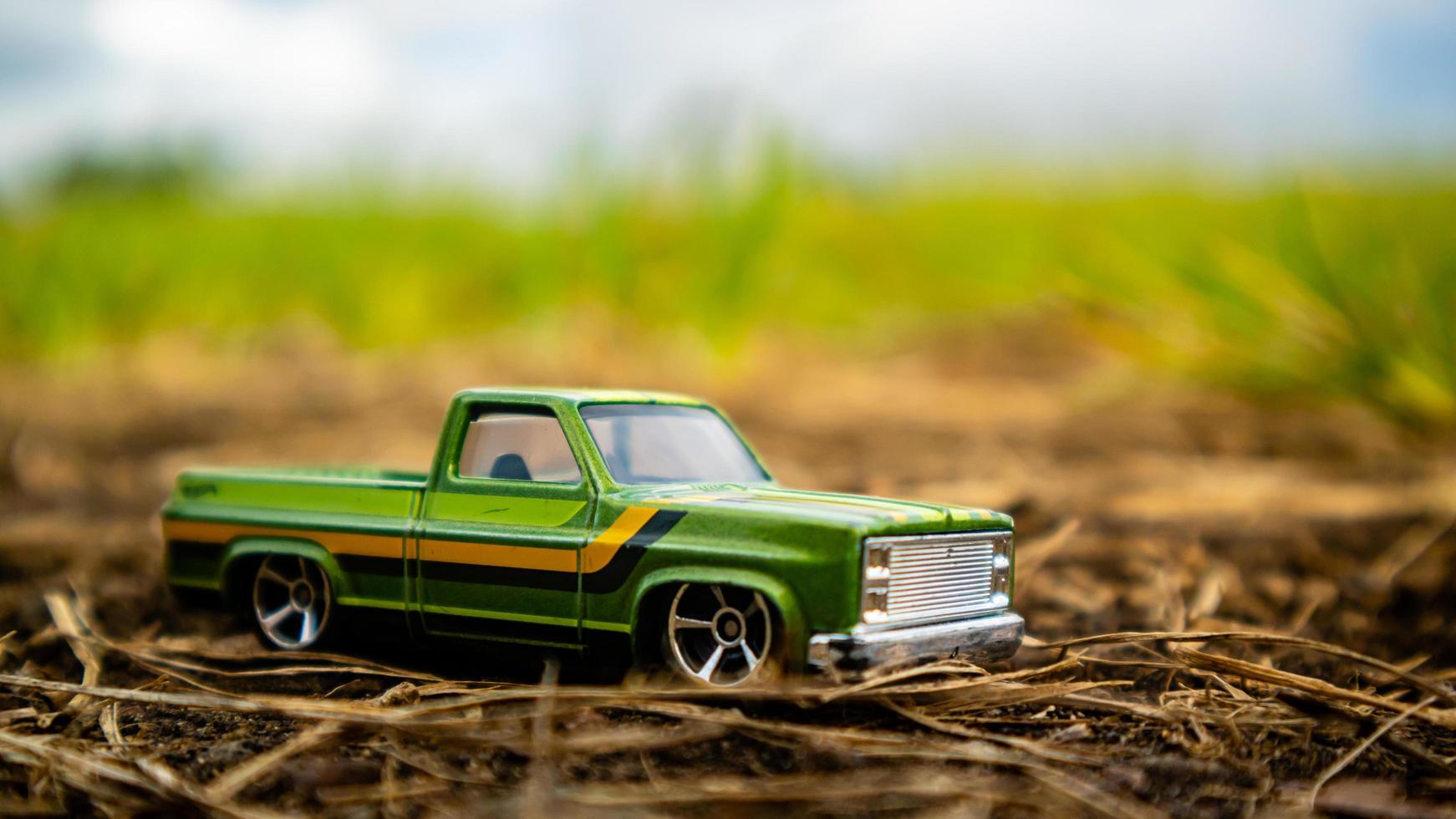 South Minahasa, Indonesia  February 2023, toy car on green grass photo