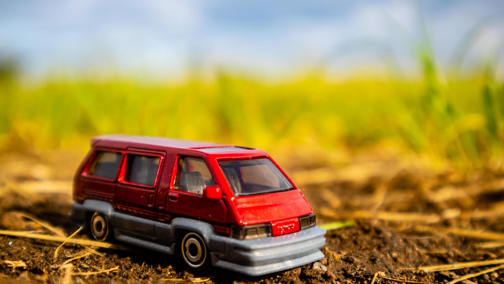 South Minahasa, Indonesia  February 2023, toy car on green grass photo