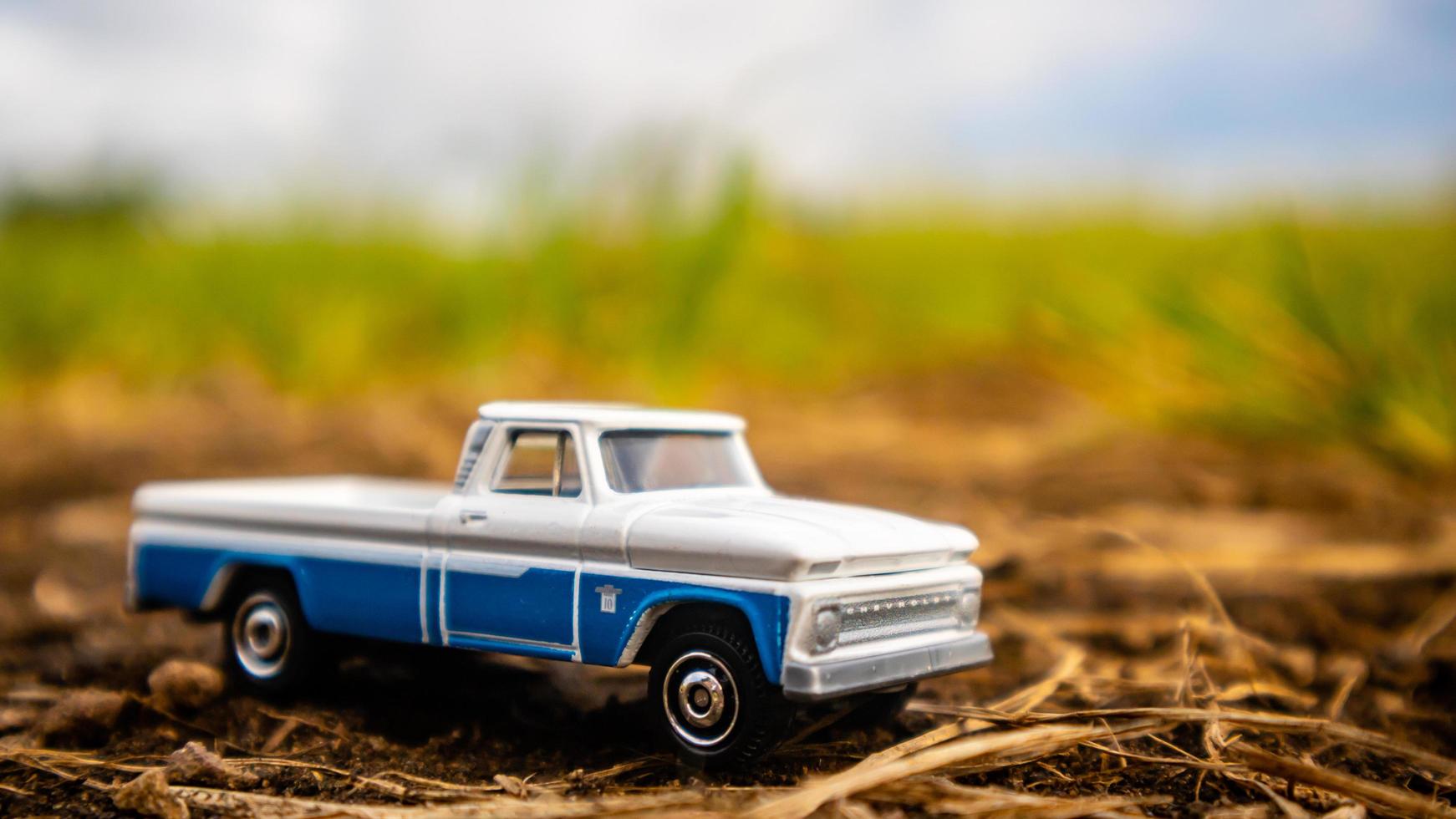 South Minahasa, Indonesia  February 2023, toy car on green grass photo