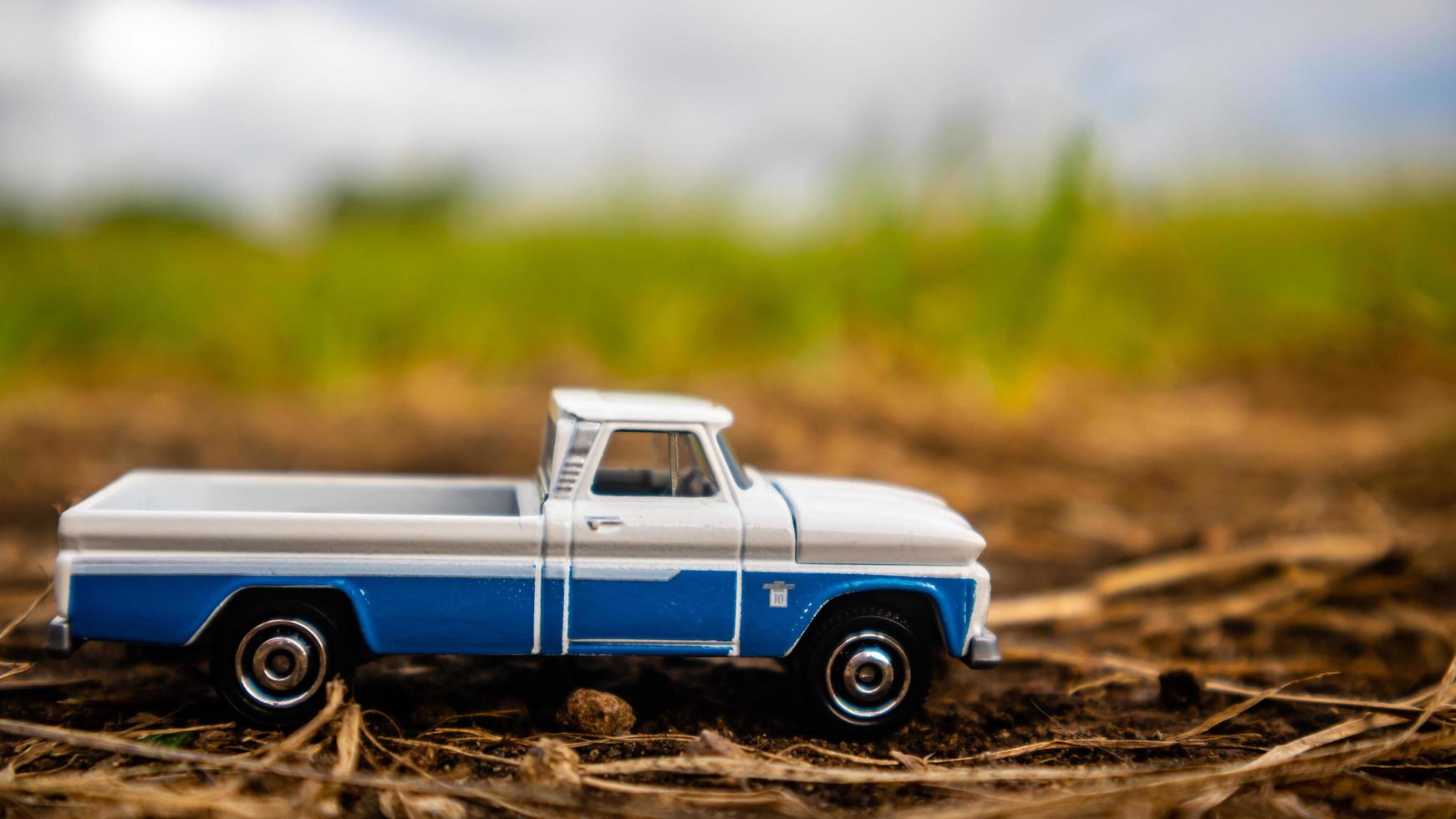 South Minahasa, Indonesia  February 2023, toy car on green grass photo