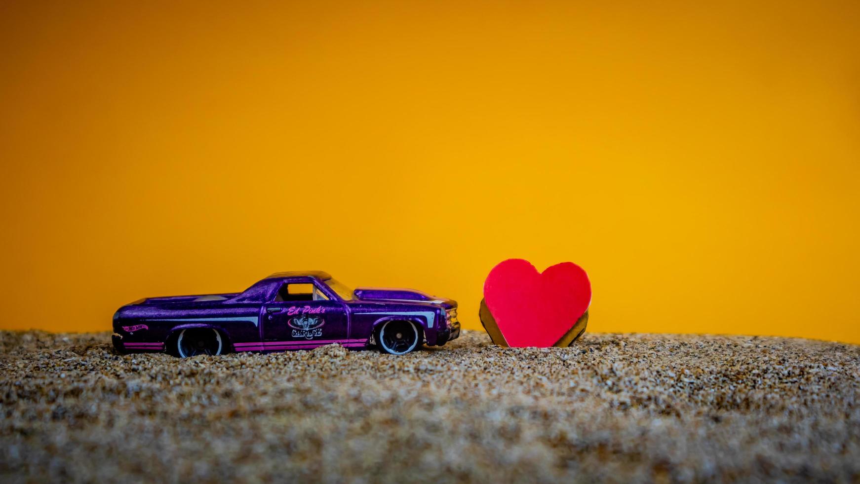 Minahasa, Indonesia  December 2022, the toy car with a heart in front of it photo