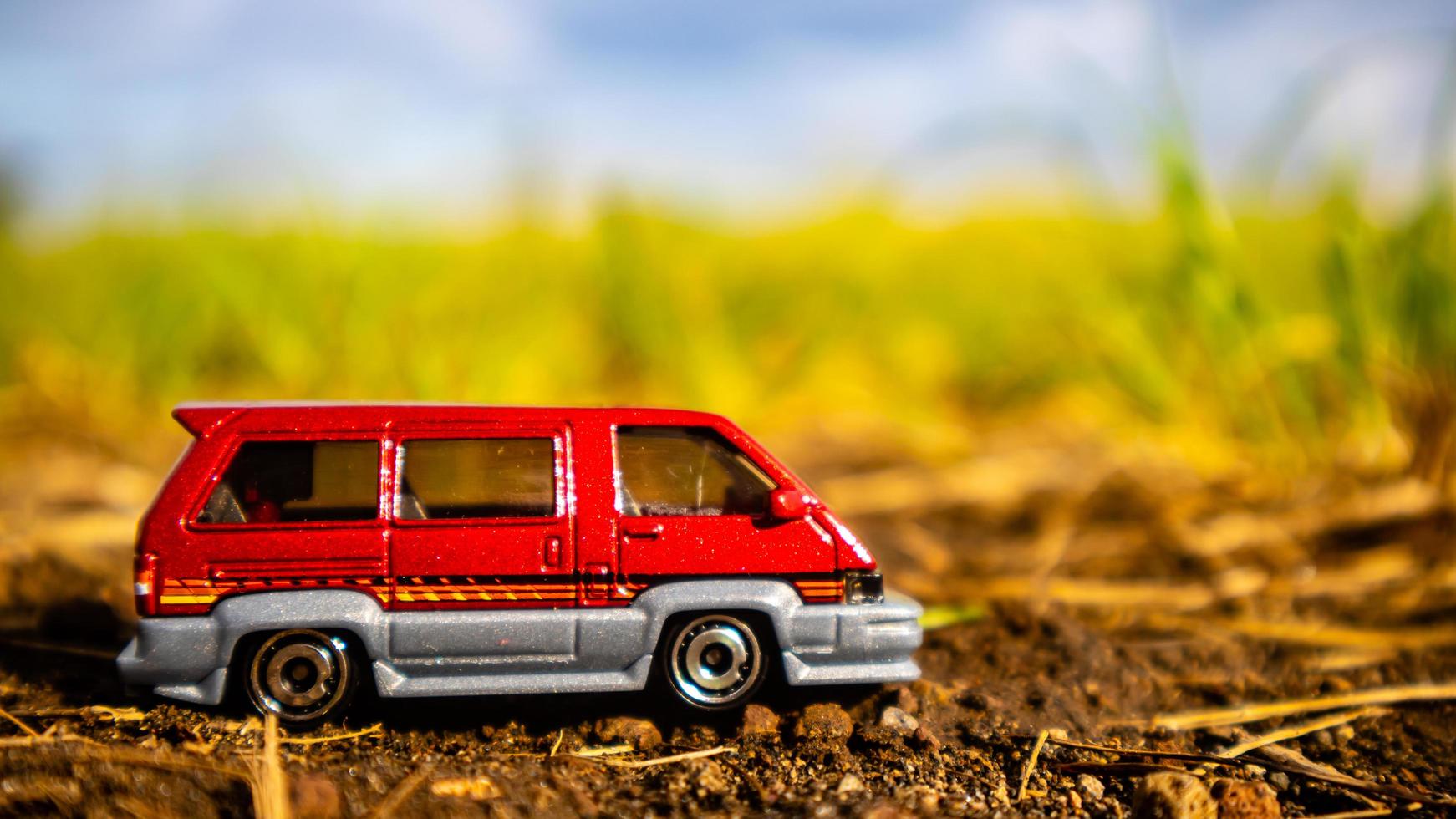 South Minahasa, Indonesia  February 2023, toy car on green grass photo