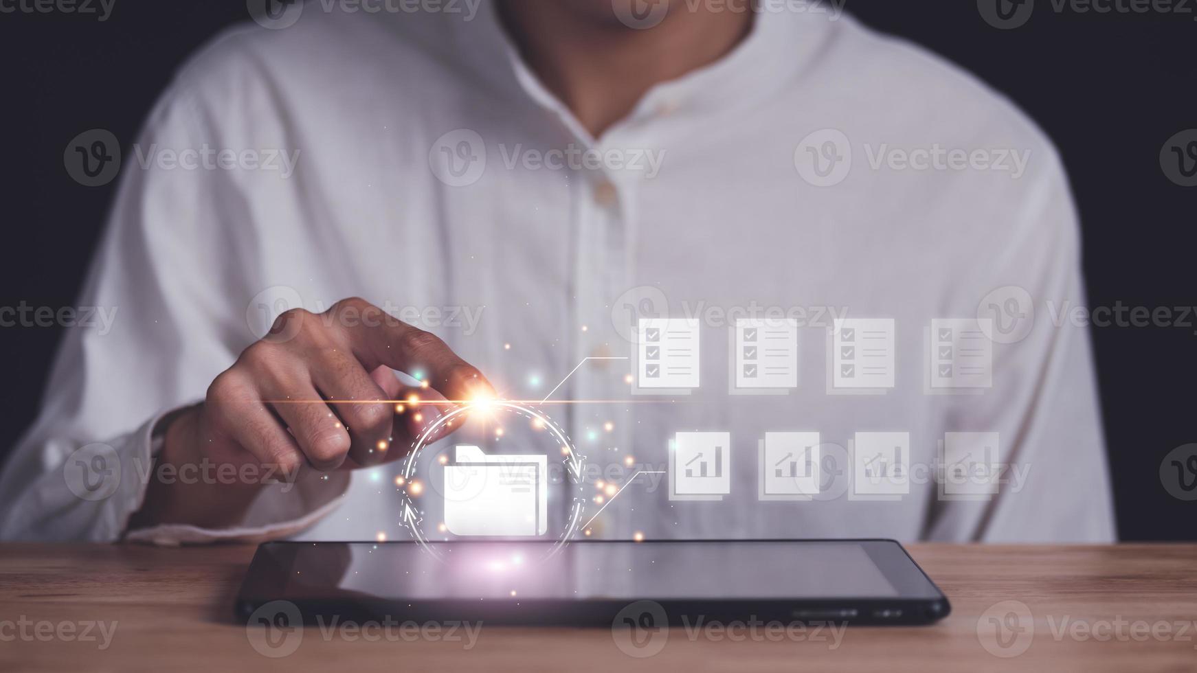 office worker working with document folder ,accounting documents ,auditor ,plan review process and assess correctness ,ERP document system management ,business document evaluation process photo
