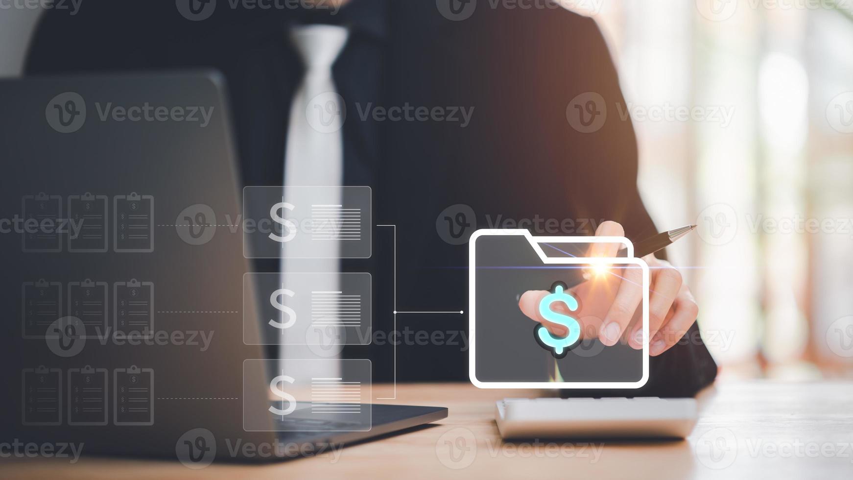 An accountant handles financial documents,Calculating financial figures with a calculator ,accounting documents ,auditor ,plan review process and assess correctness ,ERP document system management photo