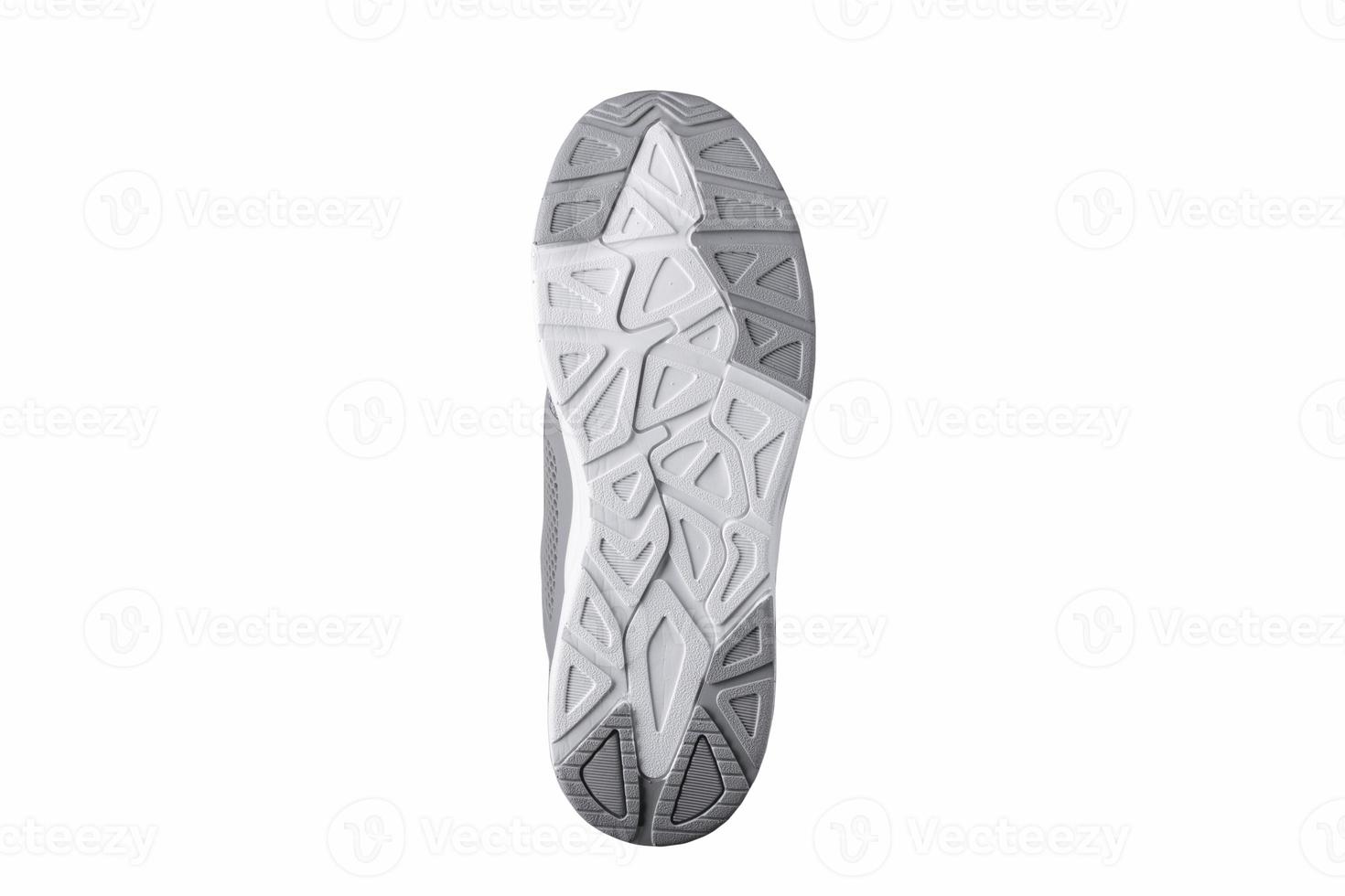 White-gray fluted rubber sole of sneakers. photo