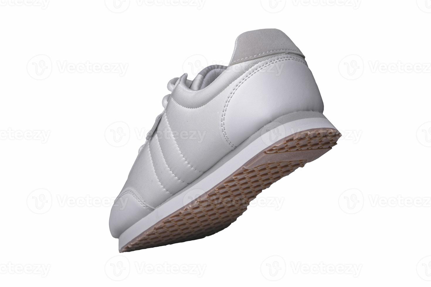 Sport shoes. White sneaker made of fabric with leather accents. photo