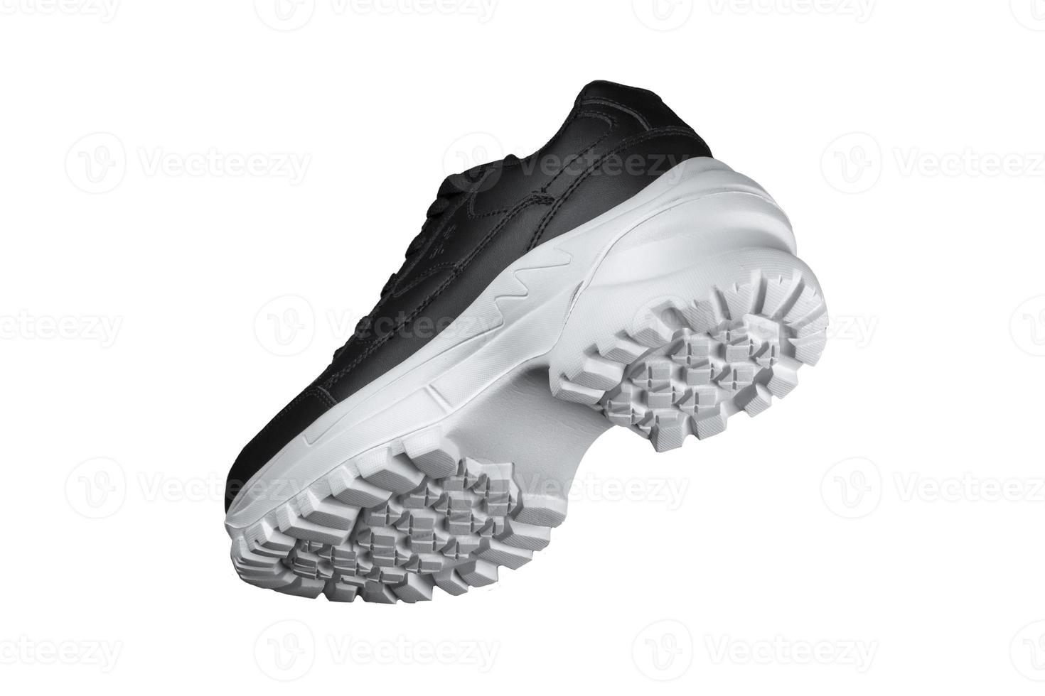 negro zapatilla de deporte con blanco único. deporte zapatos. foto
