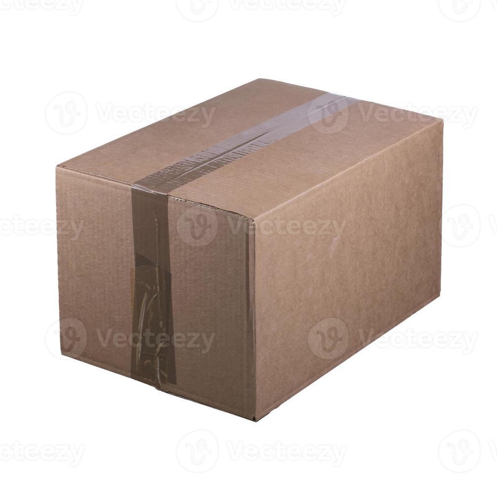Cardboard box on a white background. Box packed and sealed with tape. Container for transportation of goods. photo