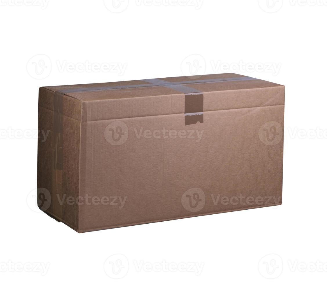 Cardboard box on a white background. Box packed and sealed with tape. Container for transportation of goods. photo