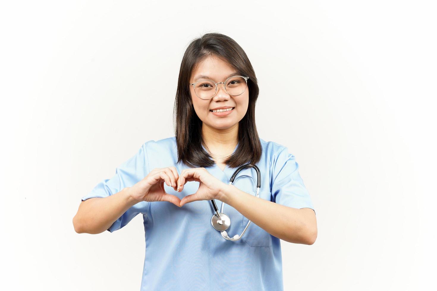 Showing Love or Heart Sign Of Asian Young Doctor Isolated On White Background photo