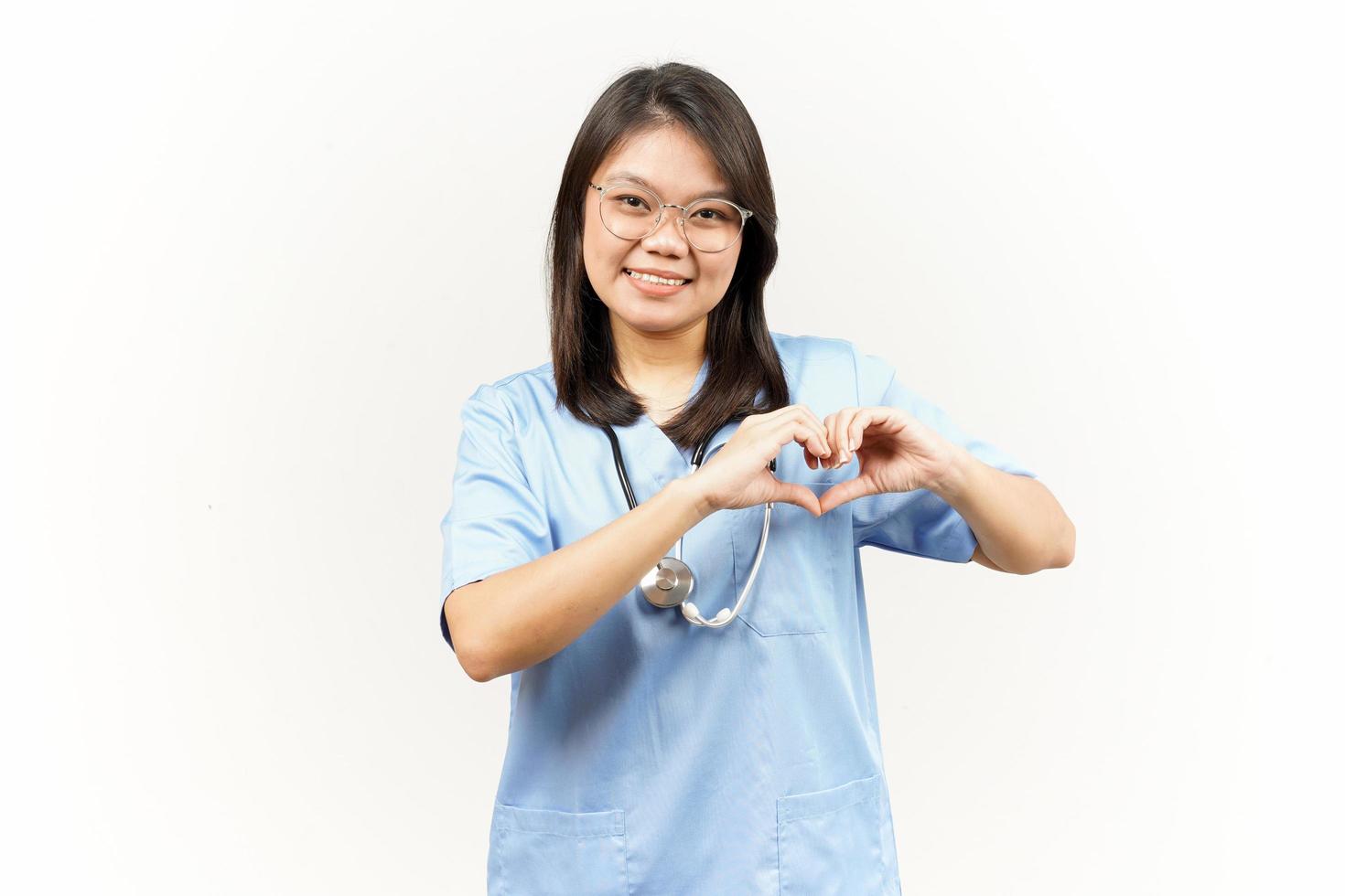 Showing Love or Heart Sign Of Asian Young Doctor Isolated On White Background photo
