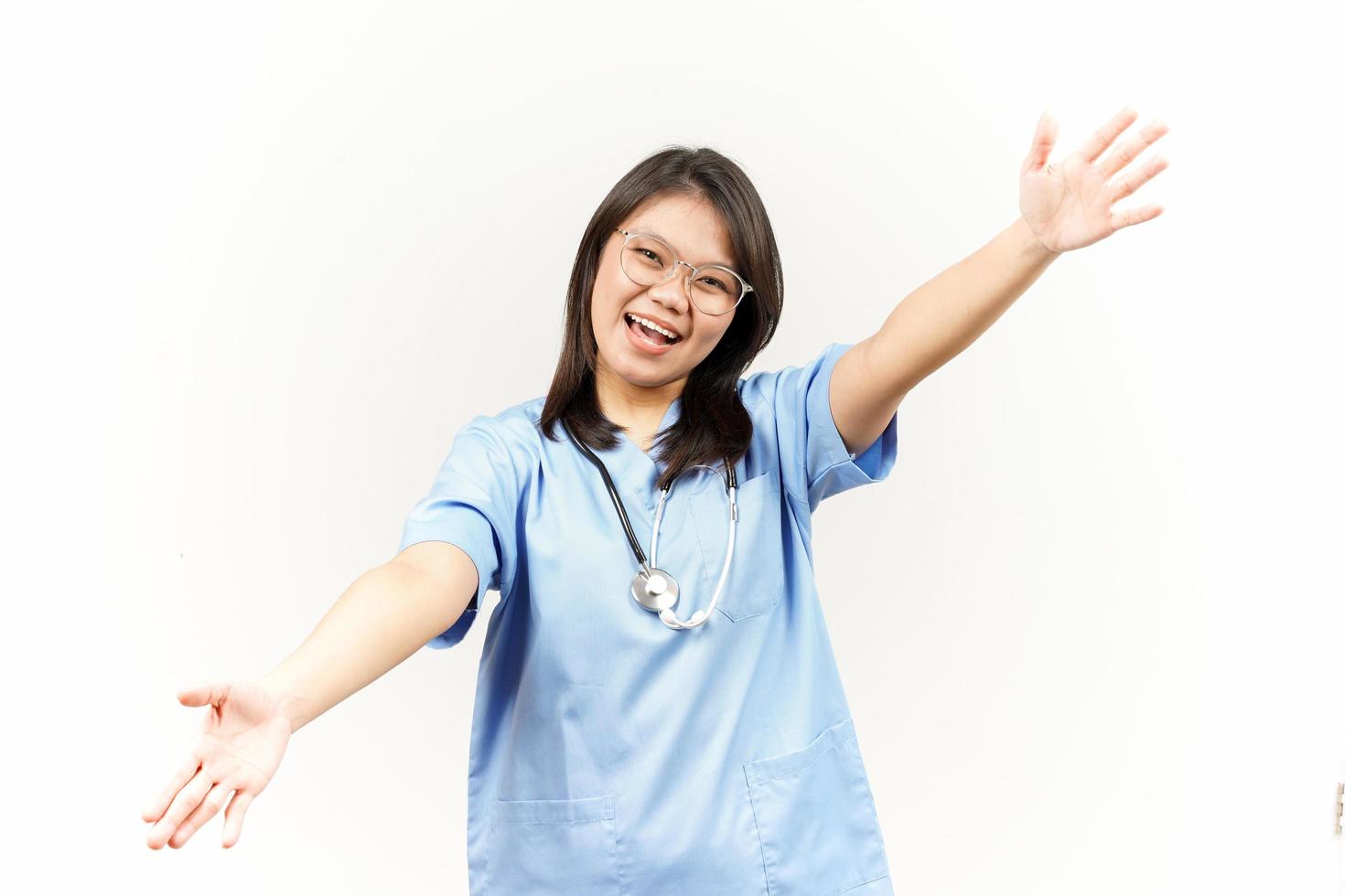 Offering Hug Of Asian Young Doctor Isolated On White Background photo