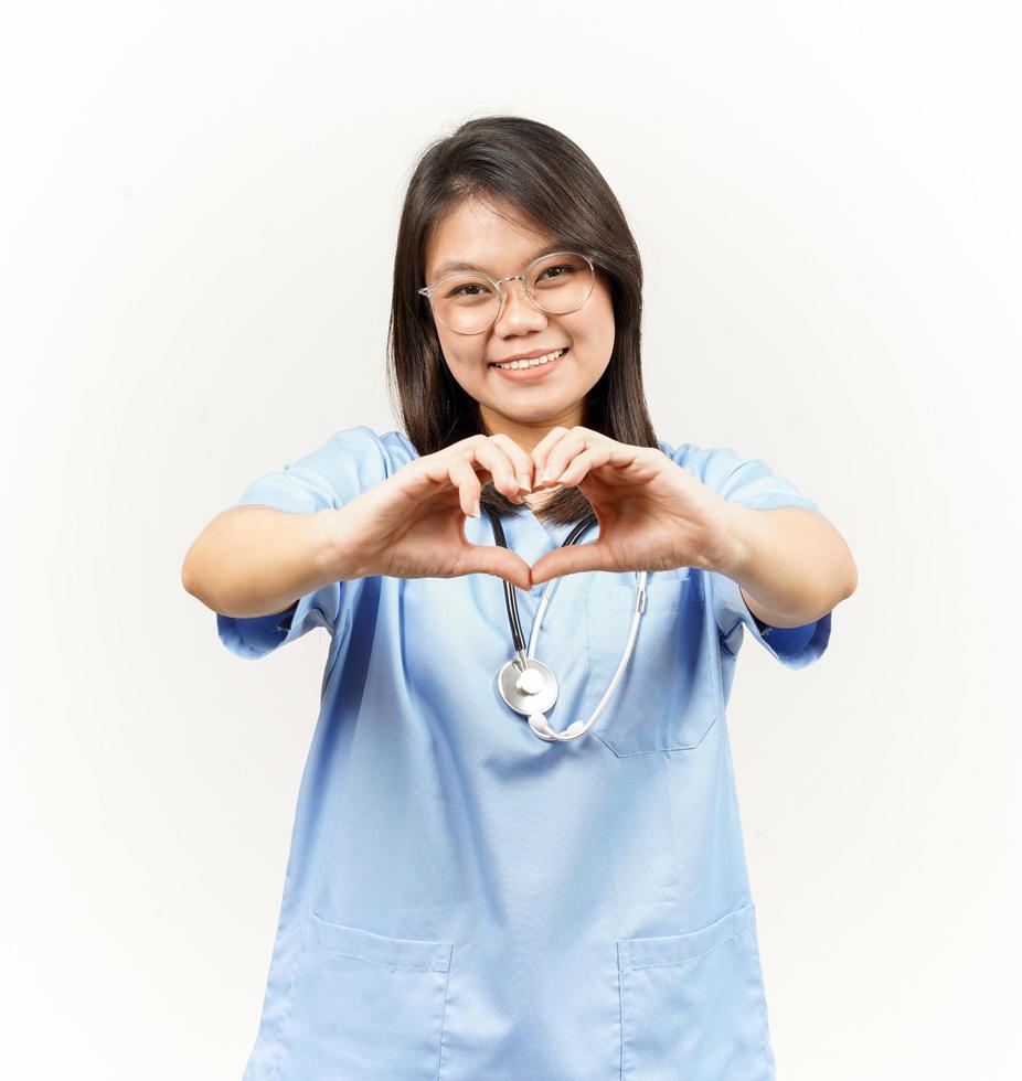 Showing Love or Heart Sign Of Asian Young Doctor Isolated On White Background photo