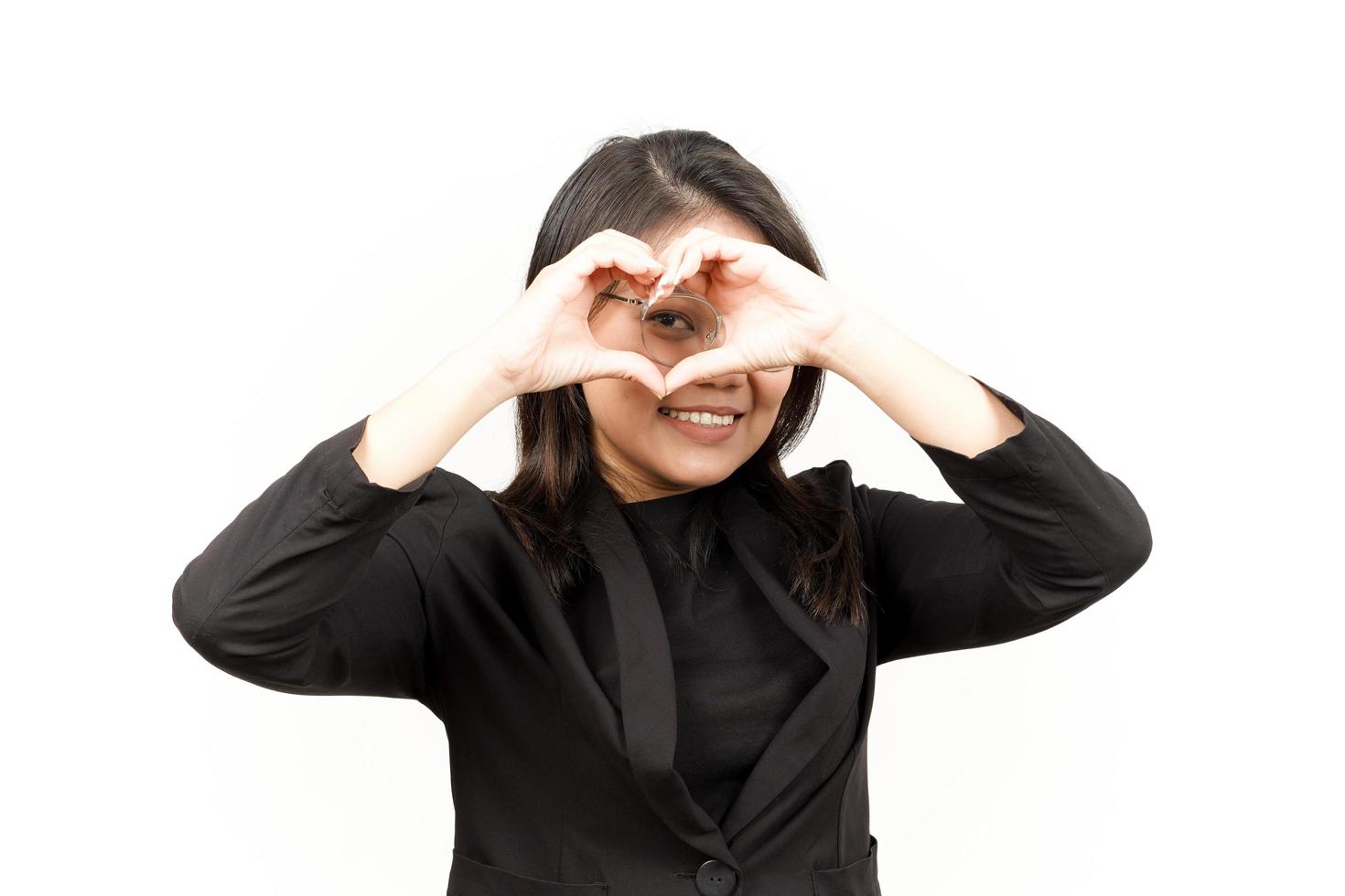 Showing Love Sign Of Beautiful Asian Woman Wearing Black Blazer Isolated On White Background photo