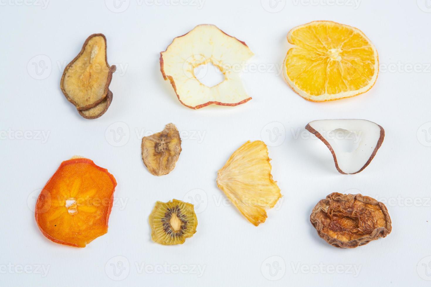 Dried fruits isolated on white background. Healthy eating concept. Top view. Healthy vegetarian food concept. Dried fruit chips. photo