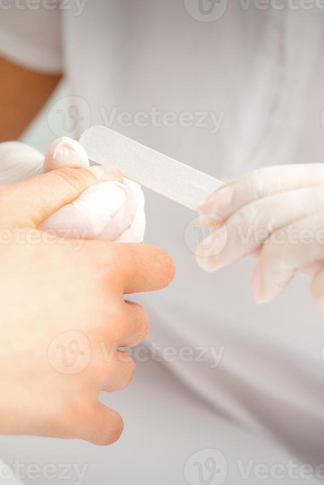 Hand receiving the nail file photo