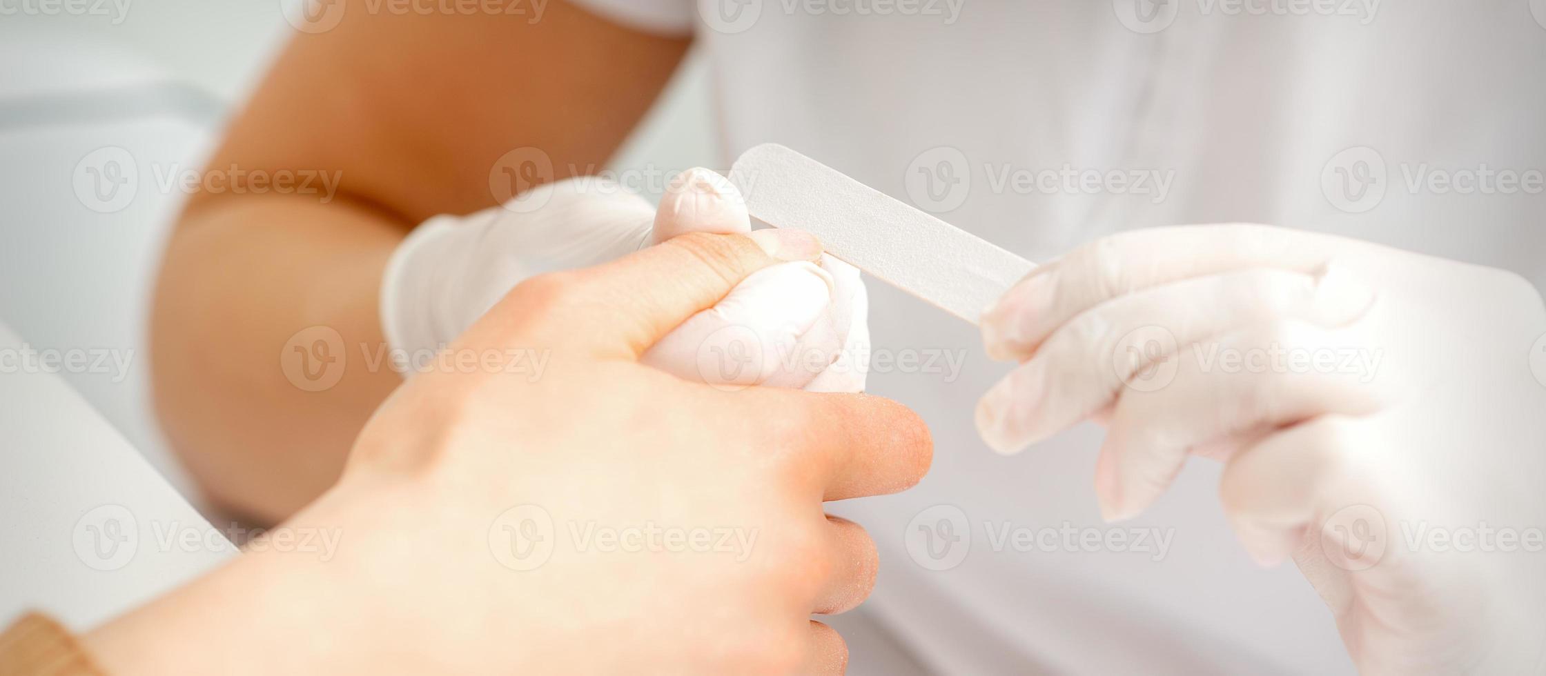 Hand receiving the nail file photo