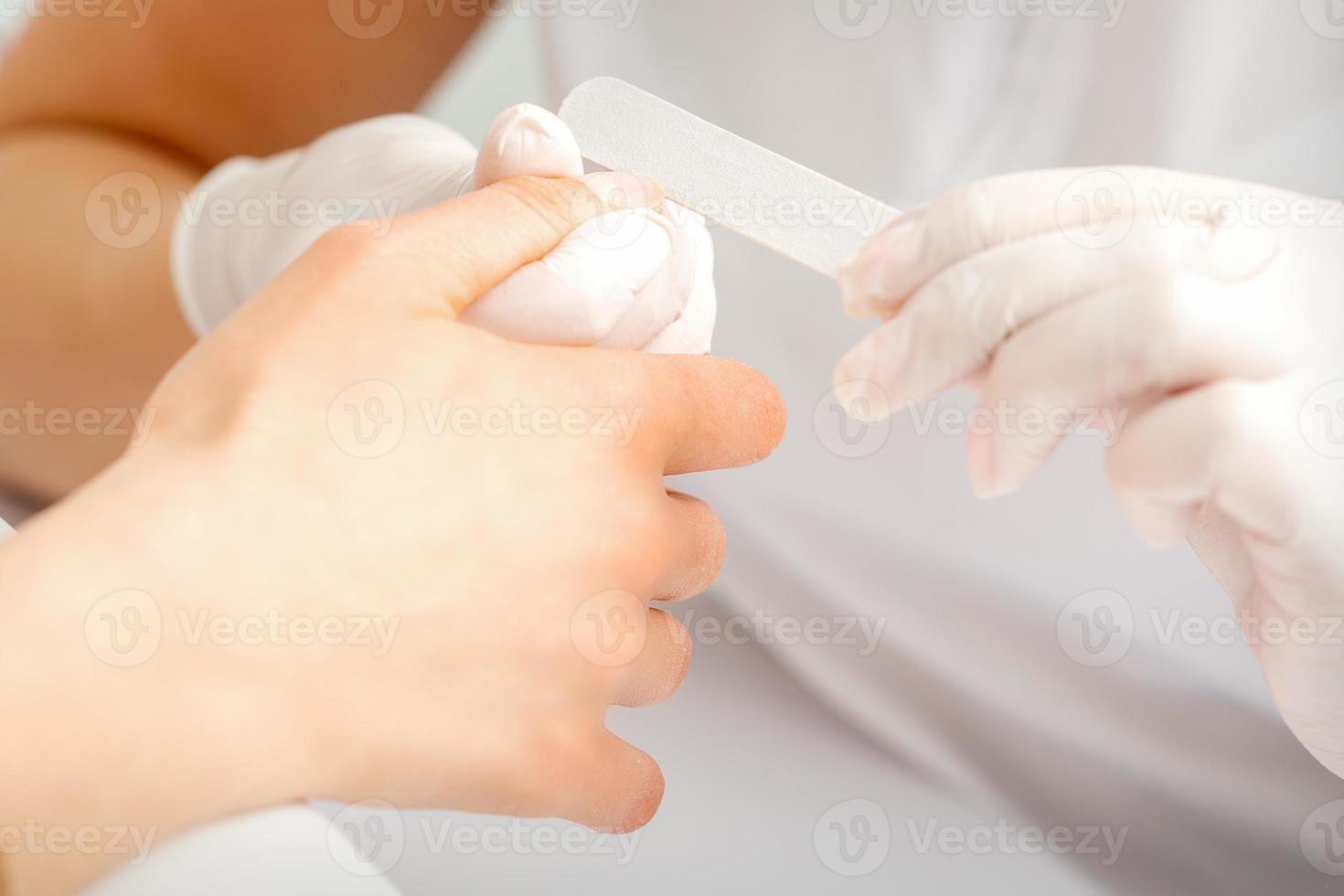 Hand receiving the nail file photo