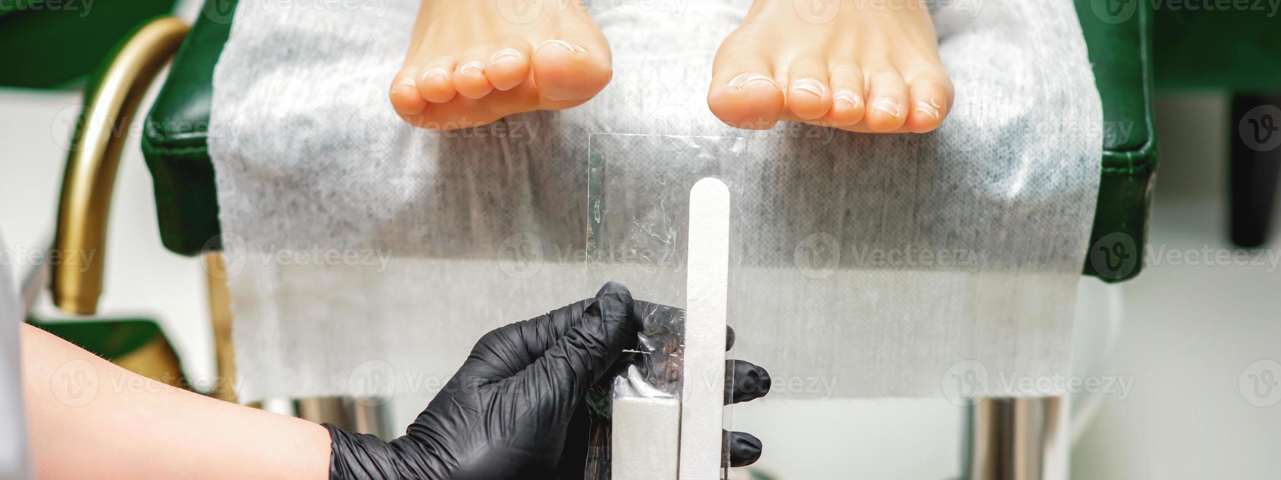 Nail file tool in hands photo