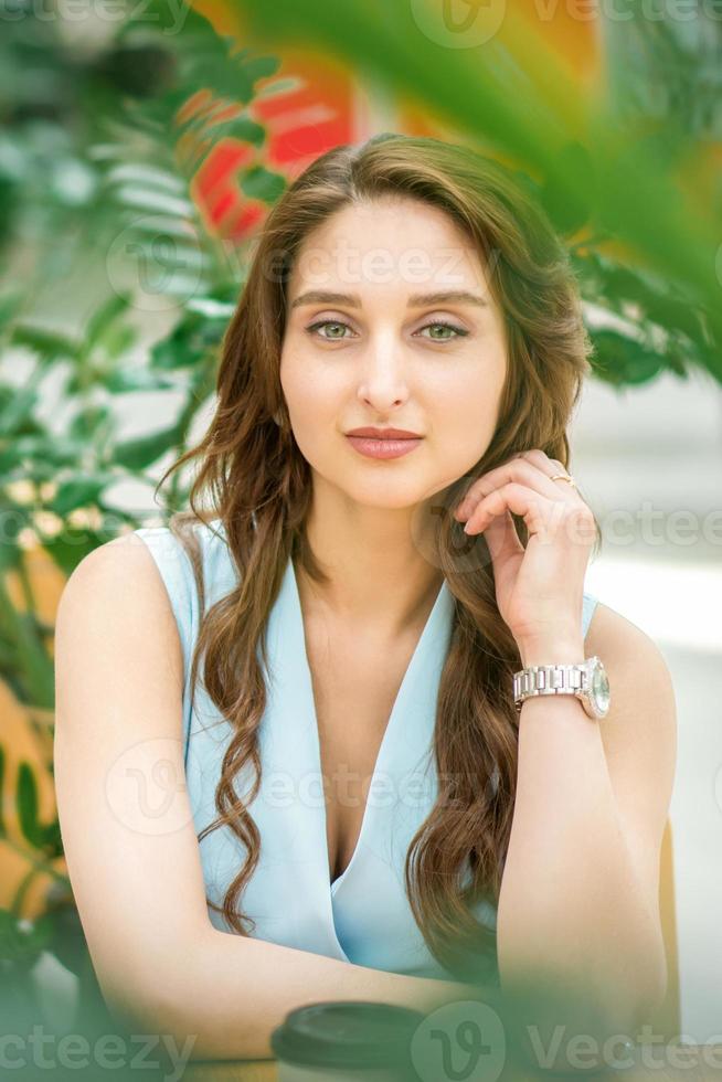 Woman sitting in flower garden photo