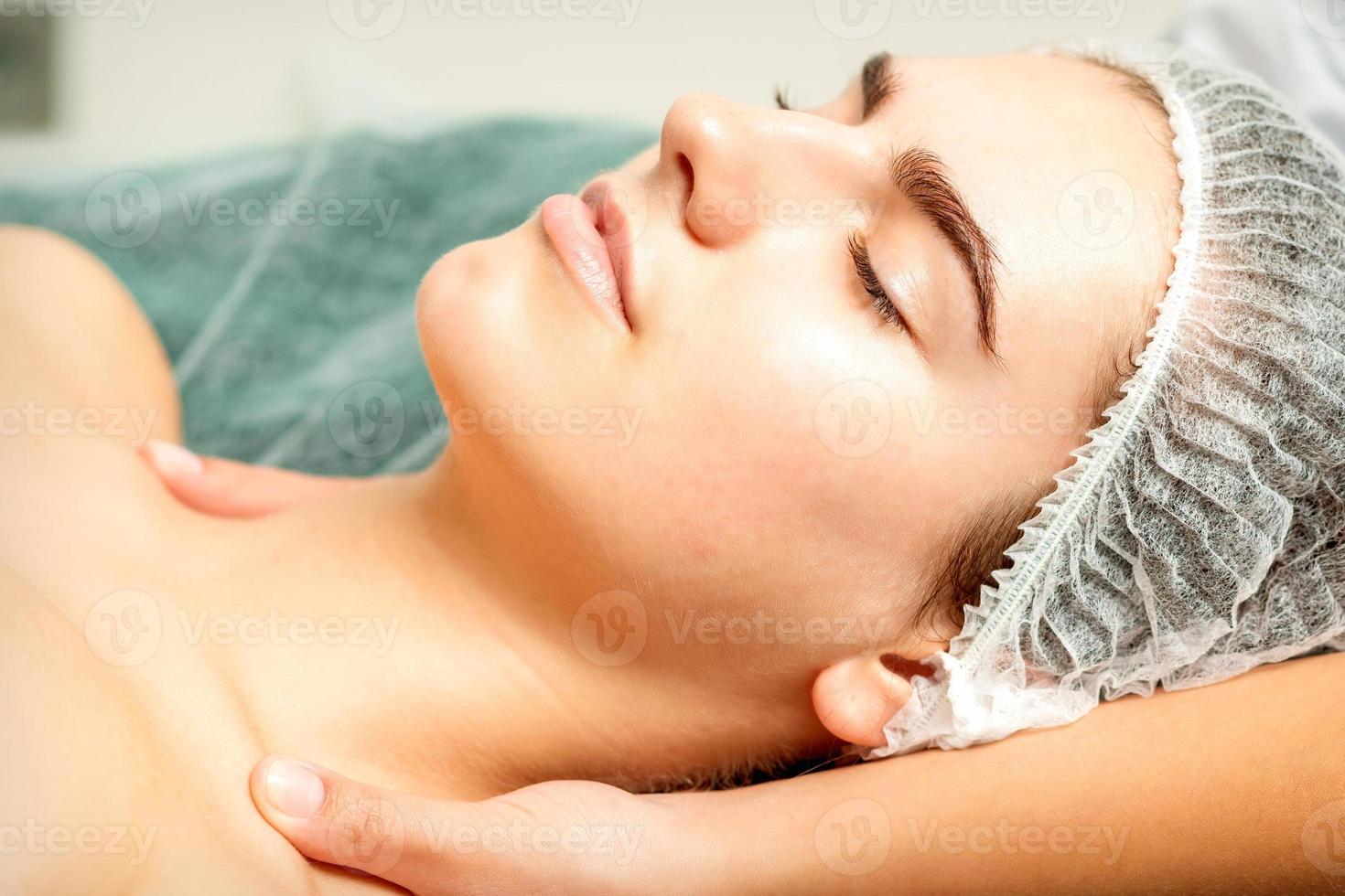 Therapist making massage of neck photo