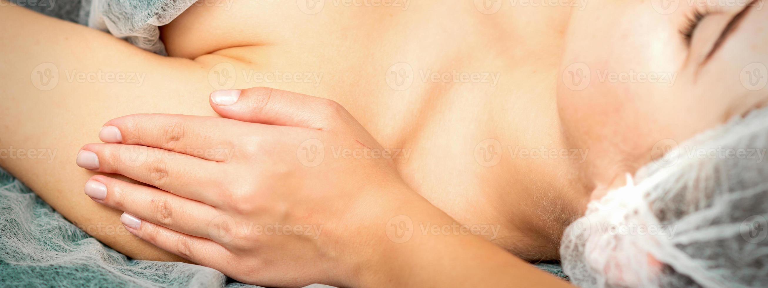 Therapist making massage of shoulders photo