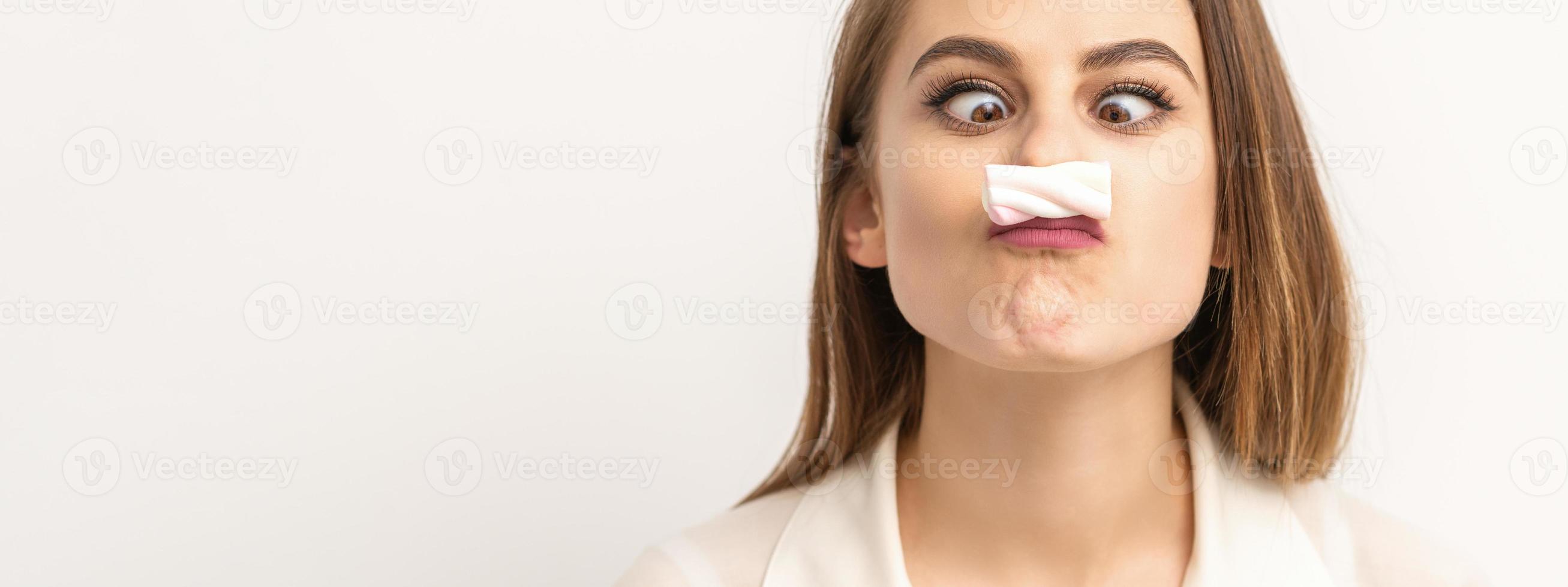 Woman with candy marshmallow-like mustache photo