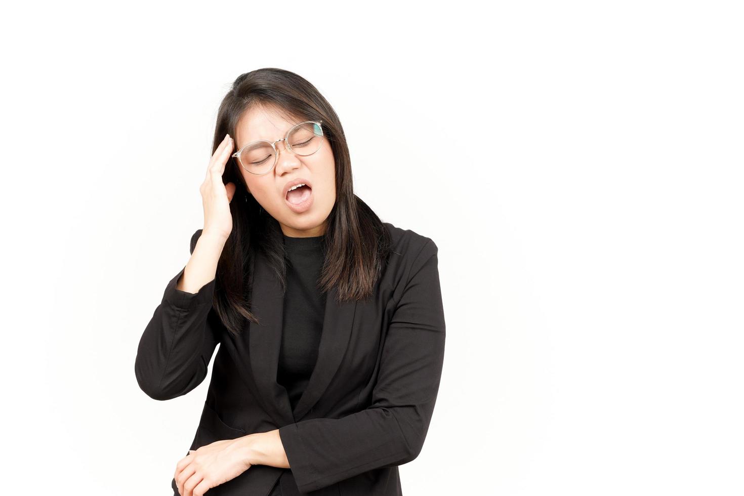 Suffering Headache Of Beautiful Asian Woman Wearing Black Blazer Isolated On White Background photo