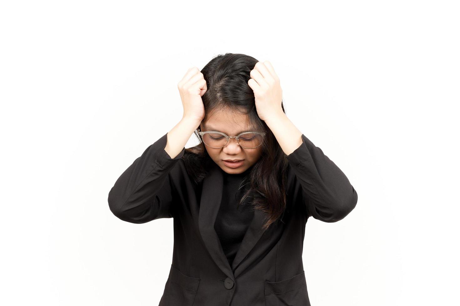 Suffering Headache Of Beautiful Asian Woman Wearing Black Blazer Isolated On White Background photo