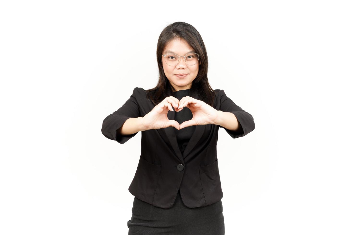 Showing Love Sign Of Beautiful Asian Woman Wearing Black Blazer Isolated On White Background photo