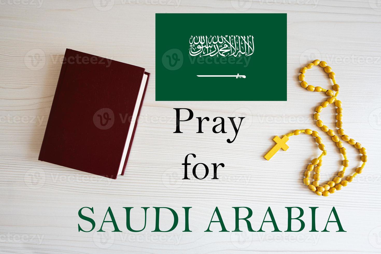 Pray for Saudi Arabia. Rosary and Holy Bible background. photo