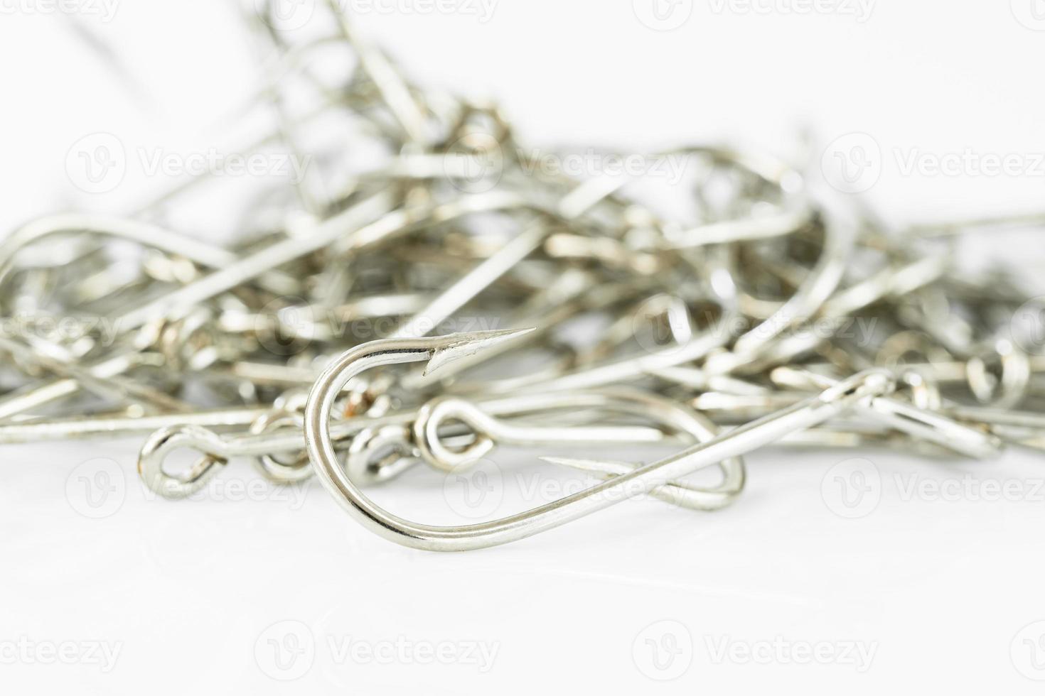 Pile of fish hook on a white photo