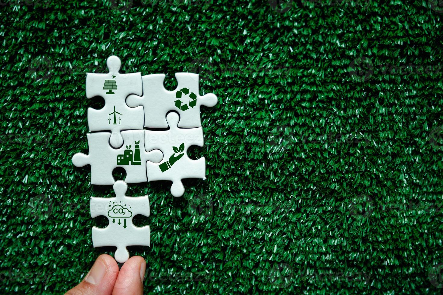 Companies are targeting net zero greenhouse gas emissions. Carbon credit concept.Tradable certificate to drive industry in direction of low emissions in efficiency cost Jigsaw puzzle with decrease CO2 photo