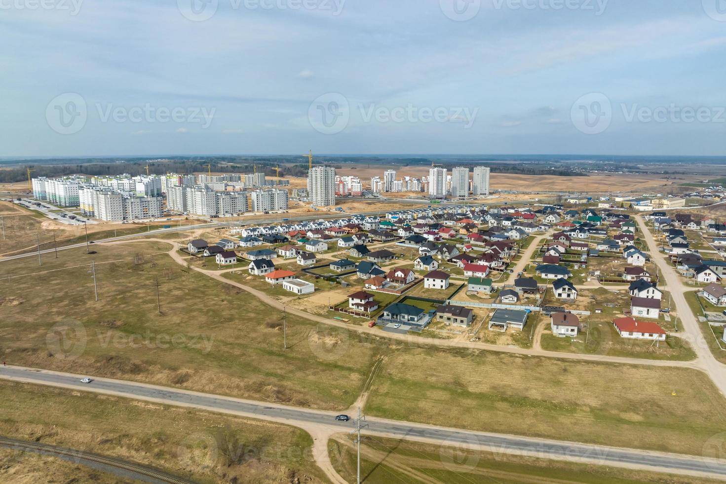 aerial panoramic view over construction of new modern residential complex with high-rise buildings in town photo