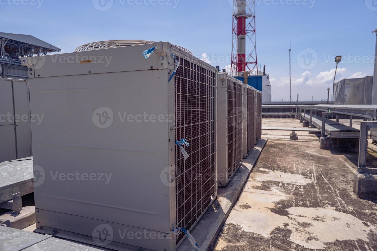 Array of outdoor fan air conditioner on the roof top building. The photo is suitable to use for construction and maintenance of air conditioner.