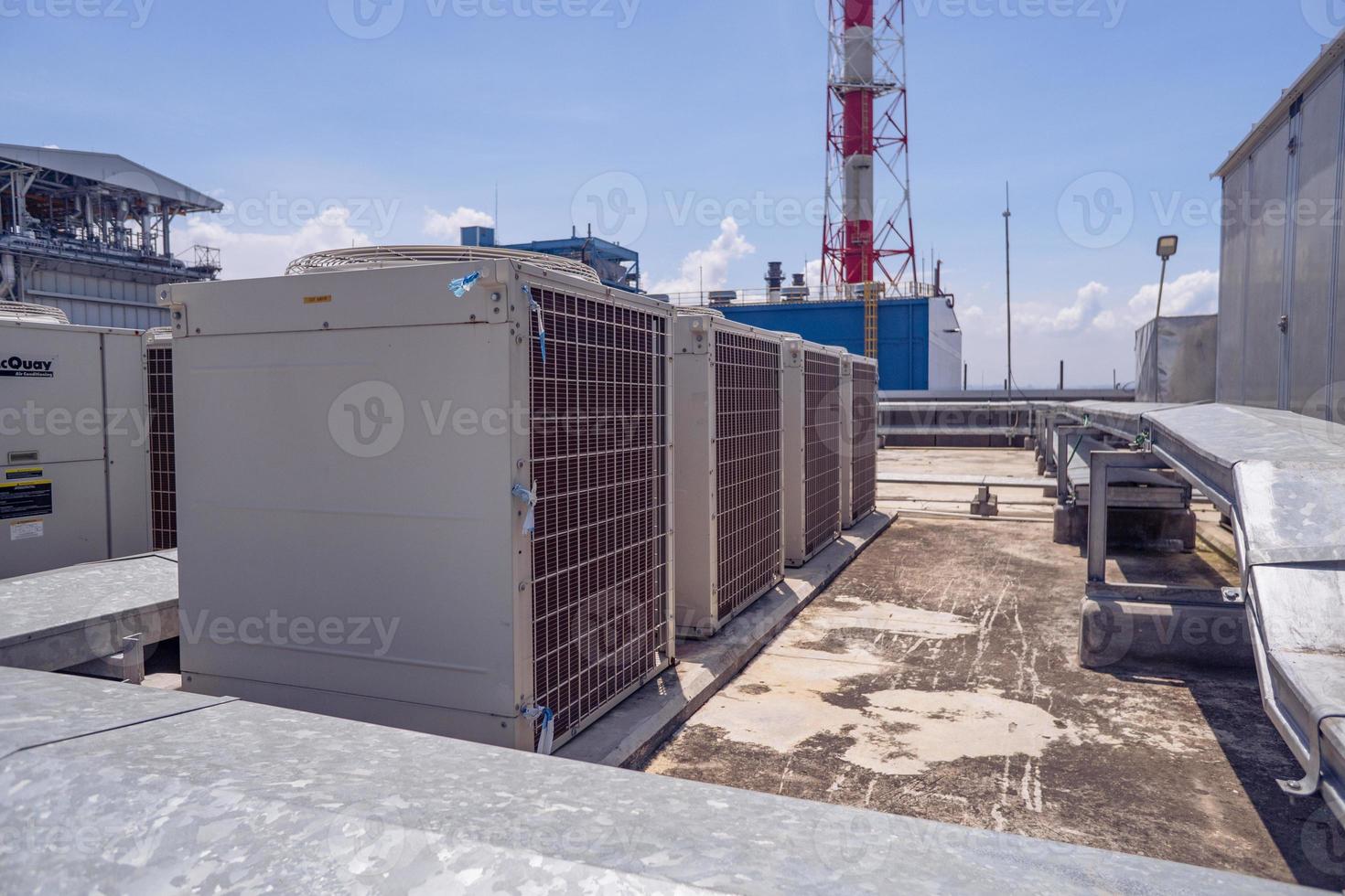 Array of outdoor fan air conditioner on the roof top building. The photo is suitable to use for construction and maintenance of air conditioner.