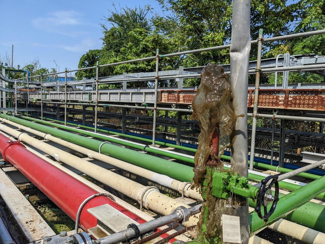 Water coming out from pipe vent when flush the service water. The photo is suitable to use for industry background photography, power plant poster and electricity content media.