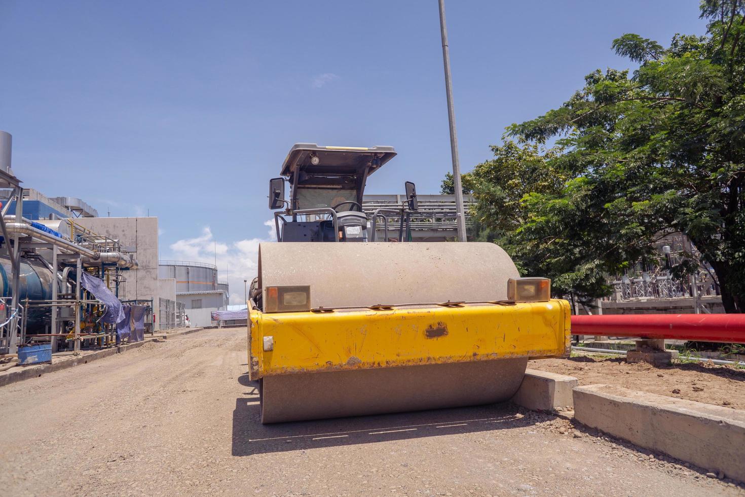 Land scraper and Vibro roller the heavy equipment for pretreatment road construction. The photo is suitable to use for industry background photography, power plant poster and electricity