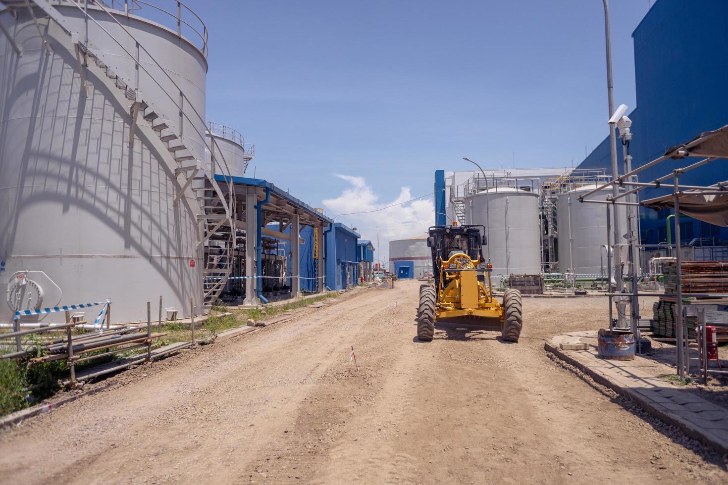 Land scraper and Vibro roller the heavy equipment for pretreatment road construction. The photo is suitable to use for industry background photography, power plant poster and electricity