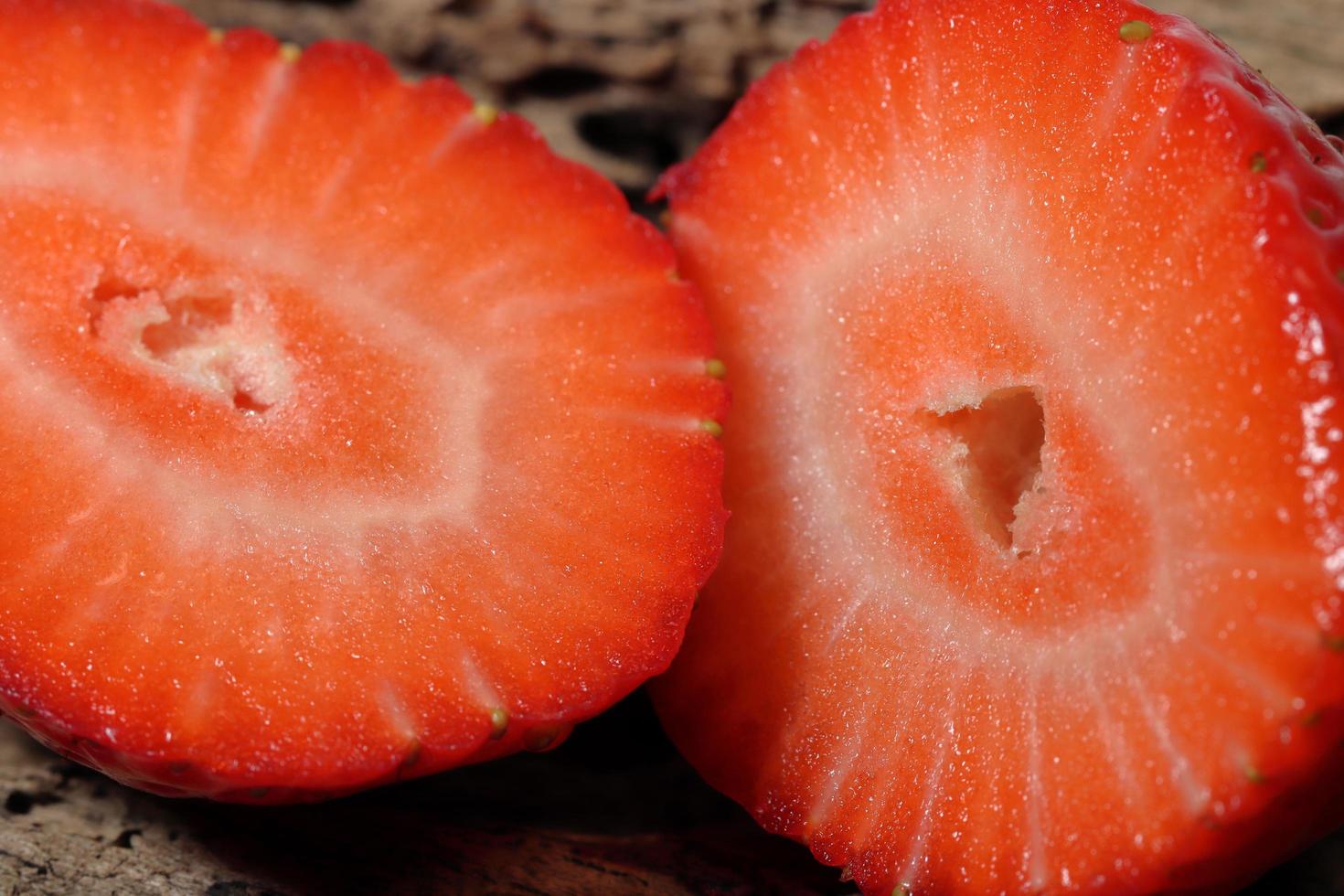 Fresh strawberry half slice in close up view photo