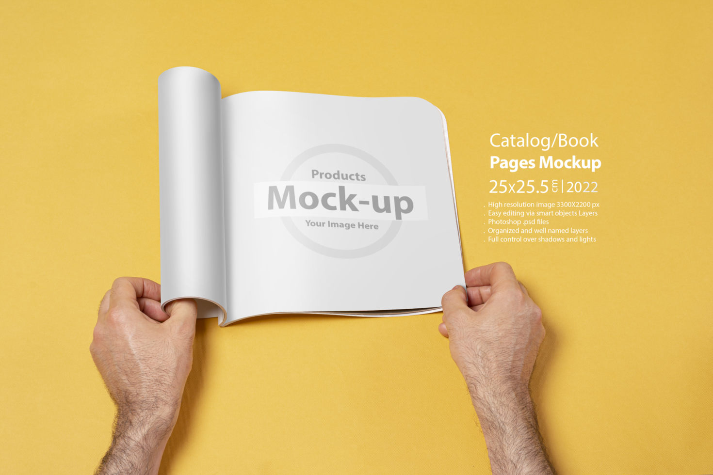 Male hand opened a presentation catalog on yellow backdrop psd