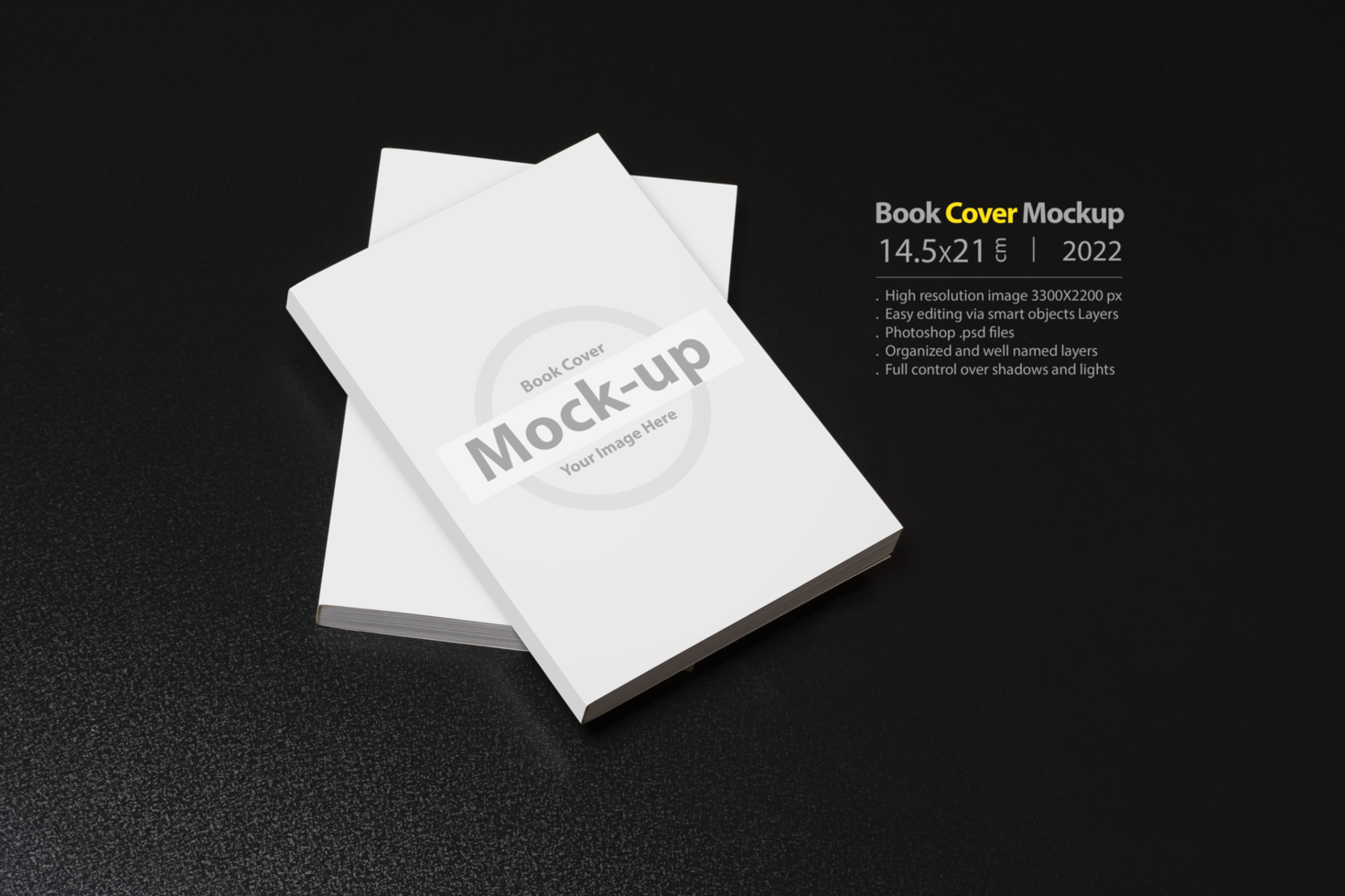 Books with blank cover on dark glossy table psd